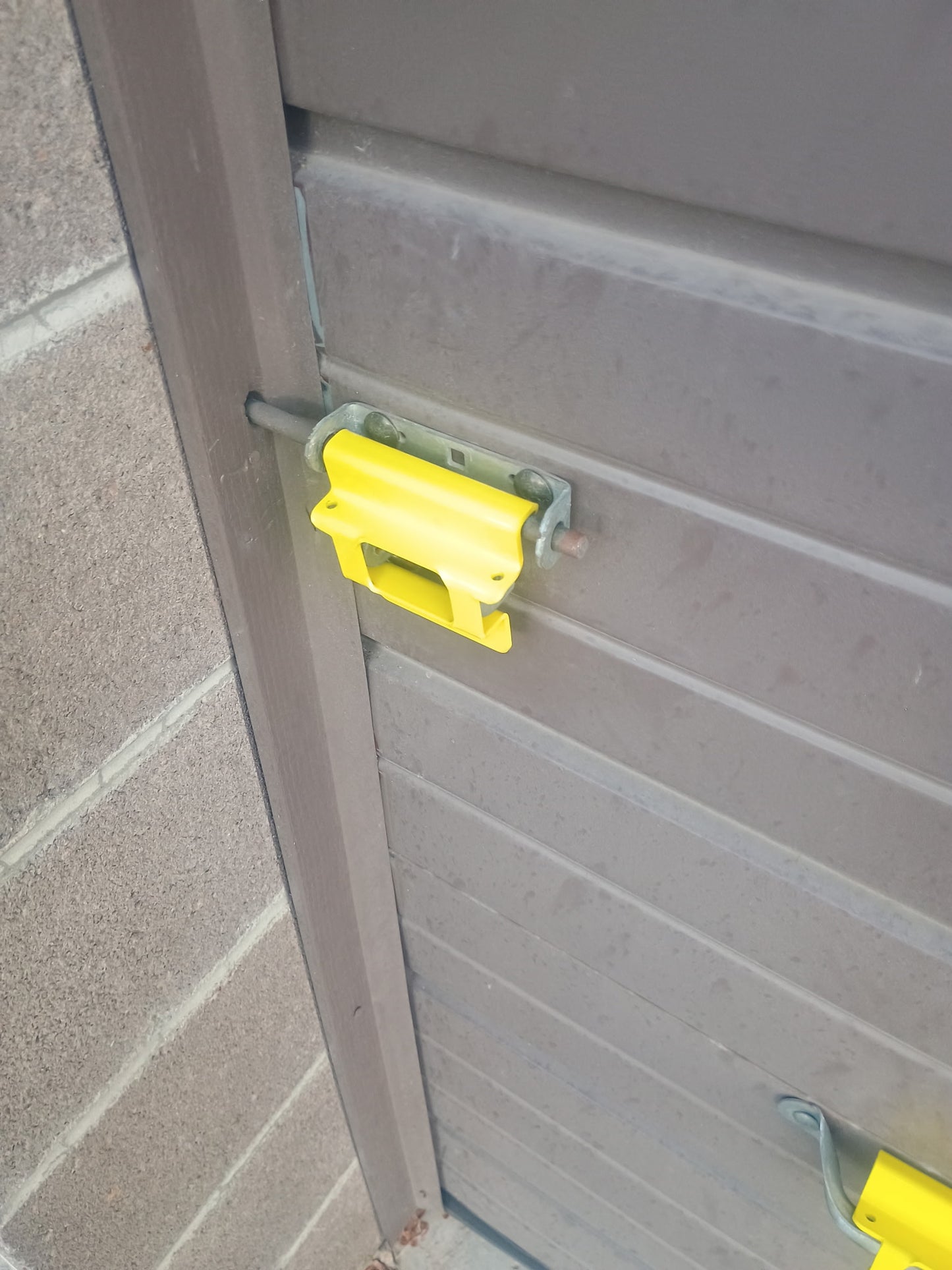 Chicago Style Lock Shield installed on storage door handle
