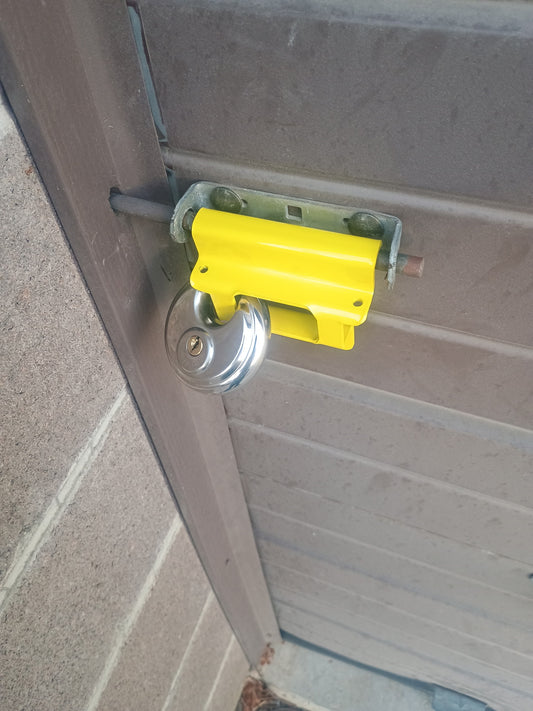 Chicago Style Lock Shield in Power Coat Yellow installed with disc lock