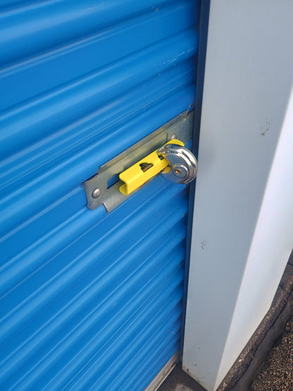 Slide Latch Lock Shield in Powder-coat yellow installed with disc lock