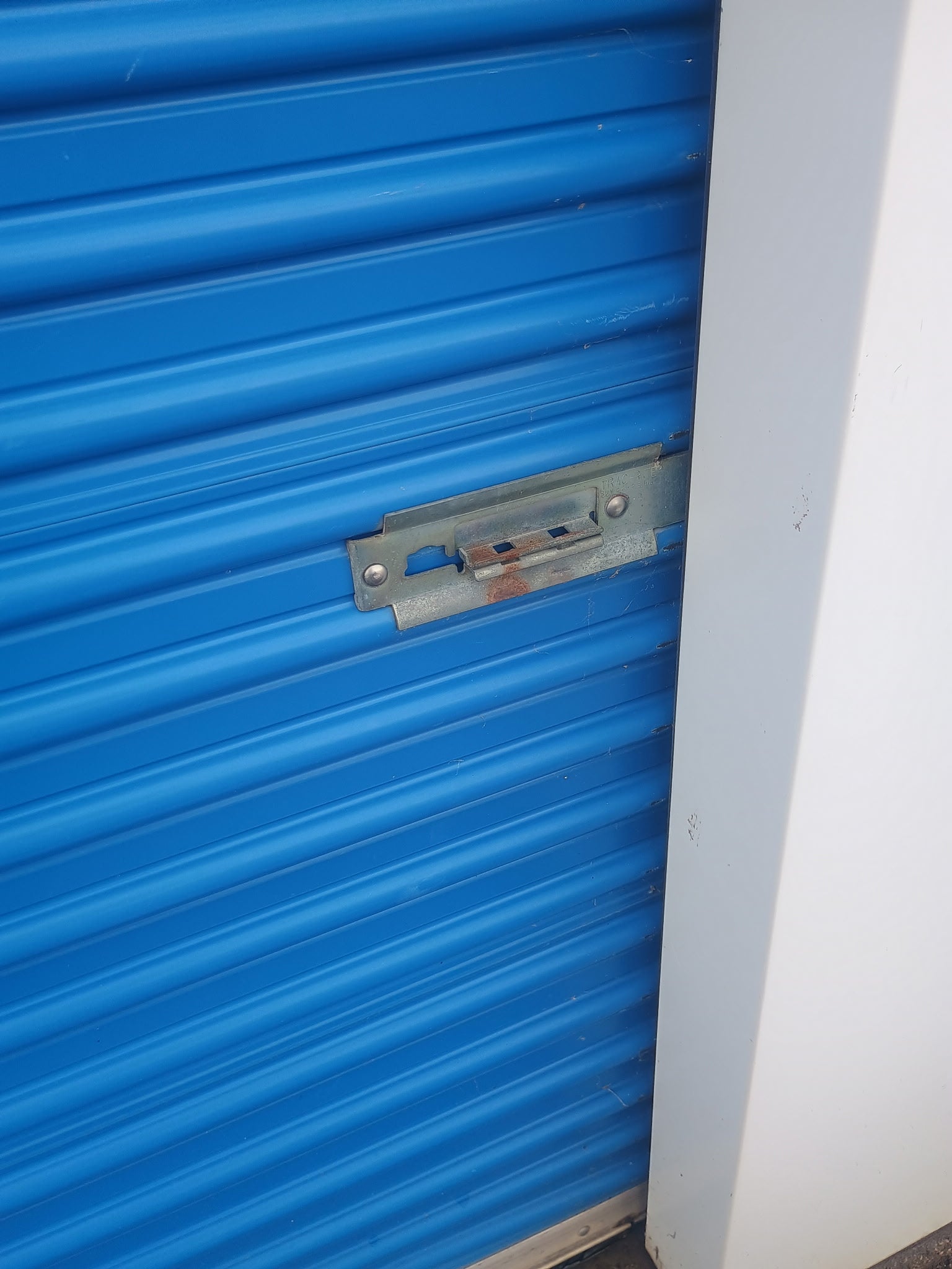 Storage door with slide lock